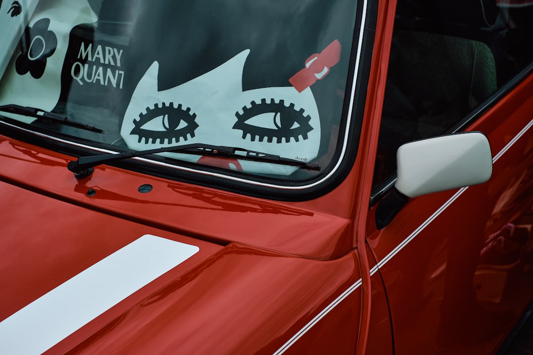 red car with white and black car door