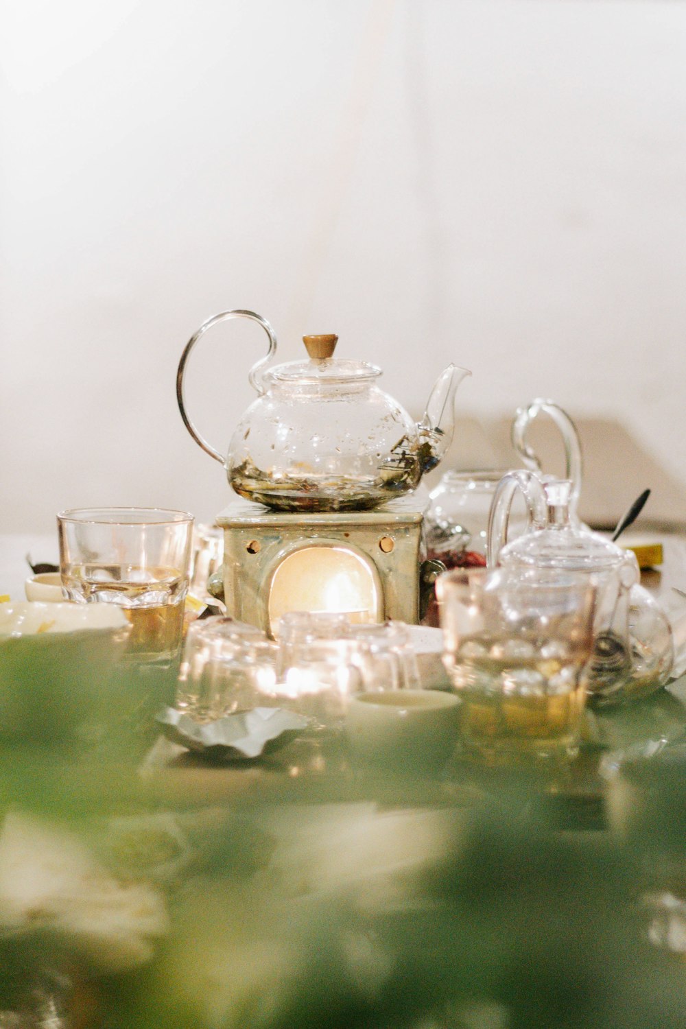 clear glass teapot on table