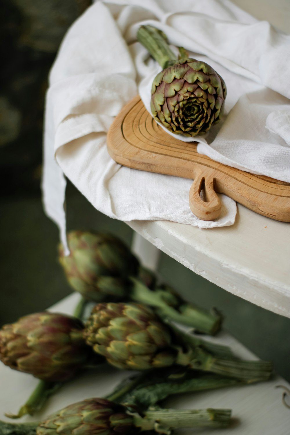 brown pine cone on white textile
