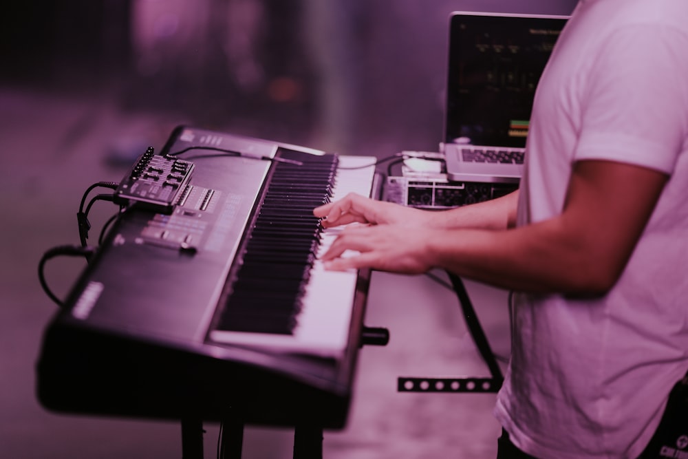 person playing black and white piano