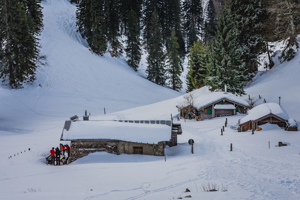 people riding on snow ski lift on snow covered mountain during daytime