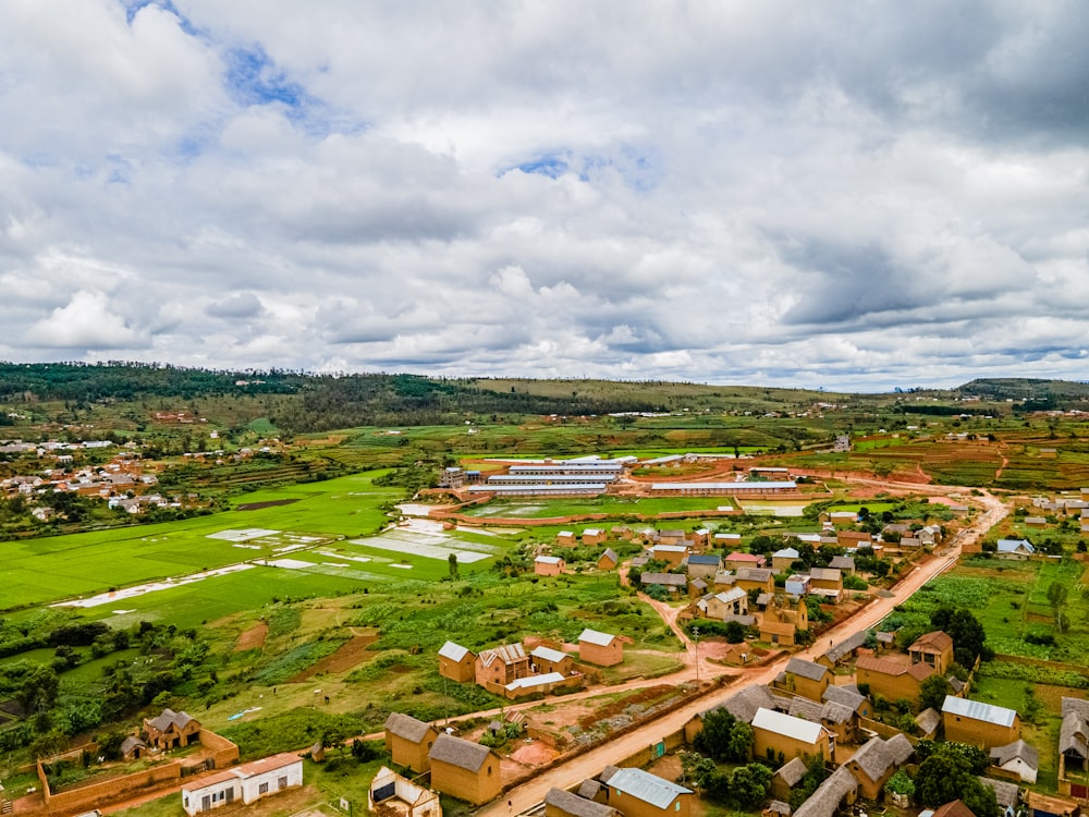 aerial view of city under cloudy sky during daytime