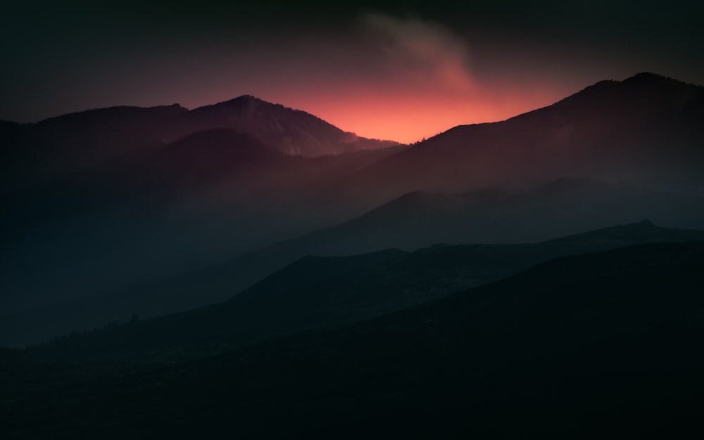 silhouette of mountains during sunset