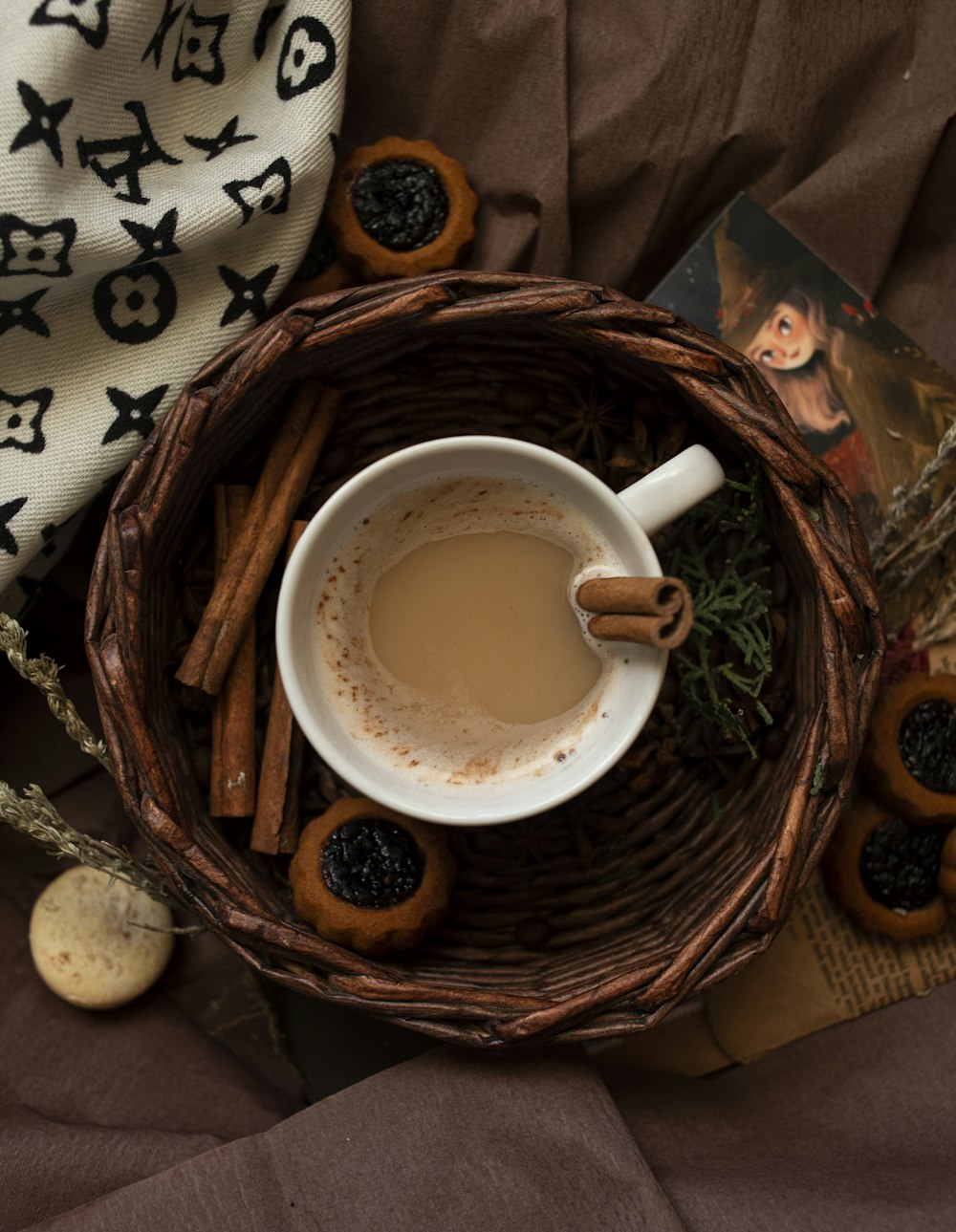 white ceramic mug on brown woven basket