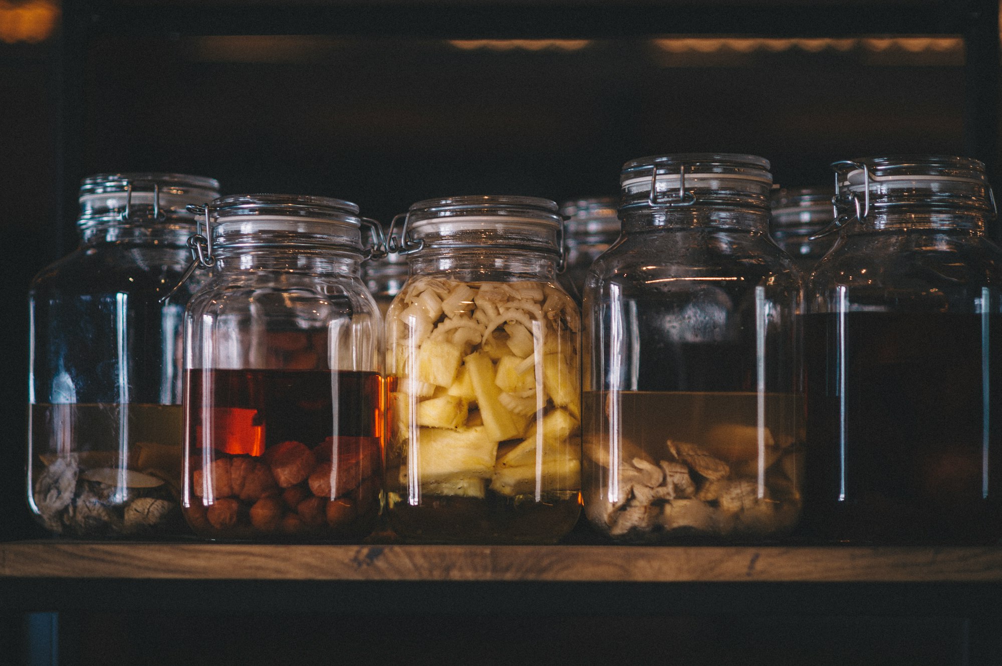 Homemade alcoholic tinctures on the shelf. 