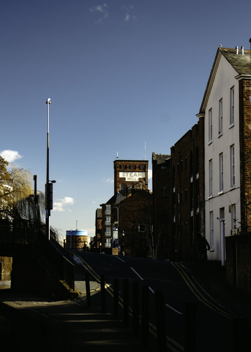 brown concrete building beside road during daytime