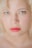 woman with blonde hair and red lipstick