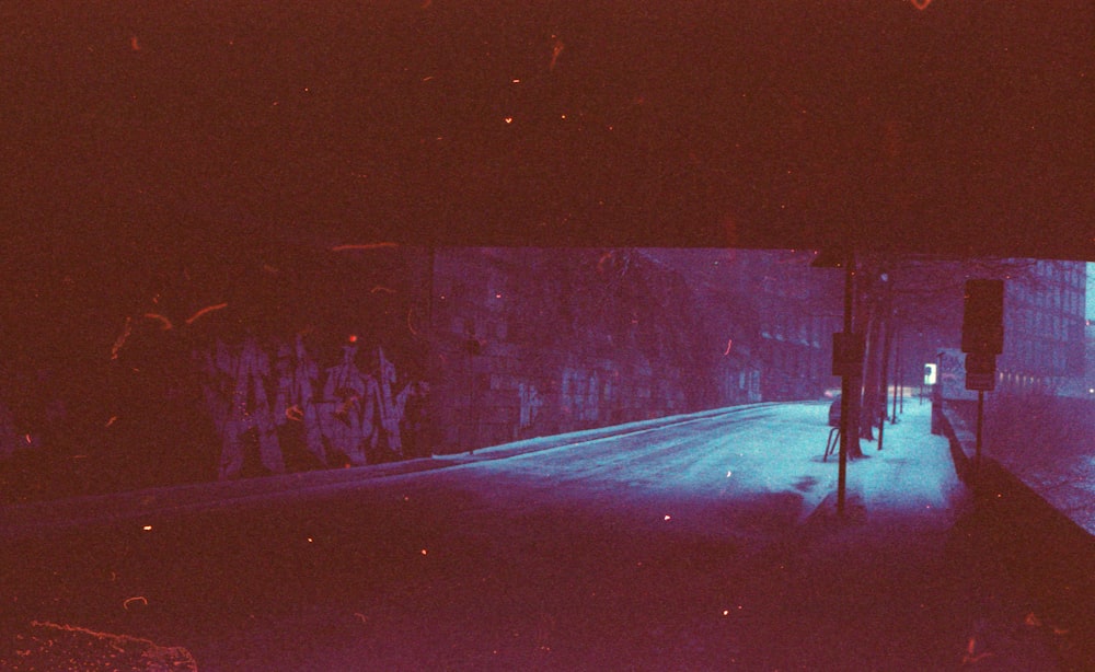 snow covered road during night time