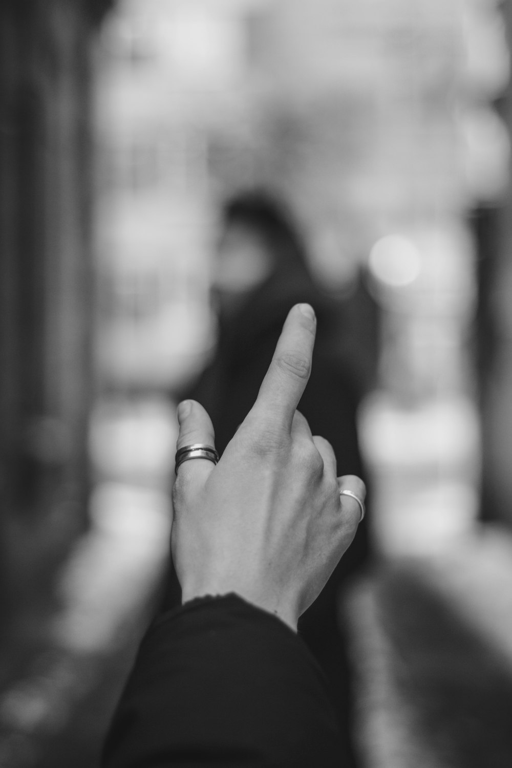 grayscale photo of person wearing ring