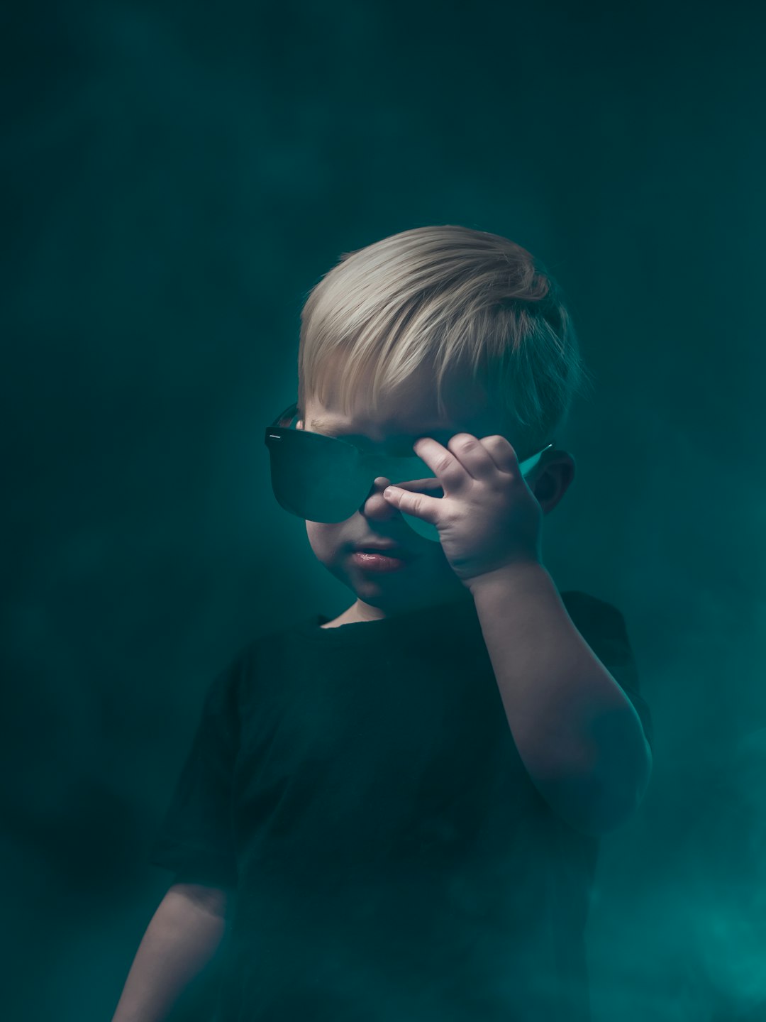 girl in black shirt wearing black sunglasses