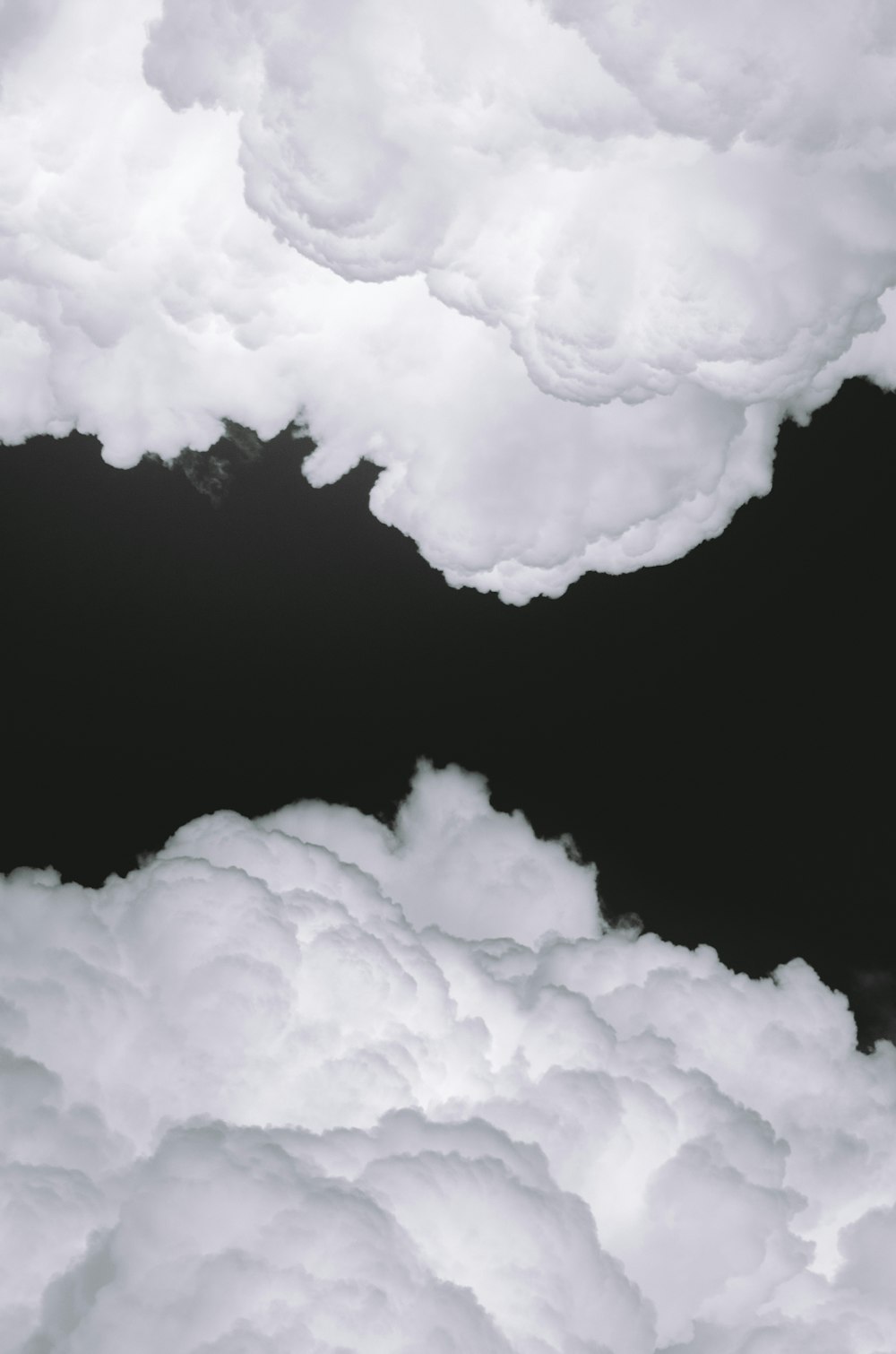 white clouds on black background