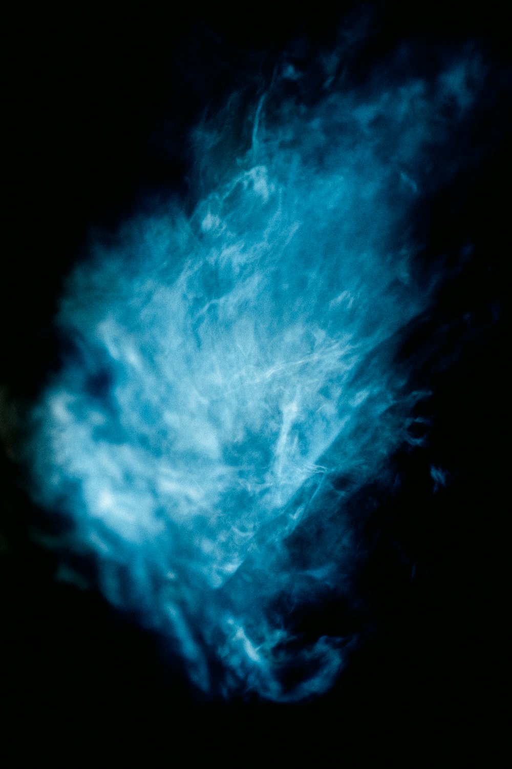 blue and white lightning on black background