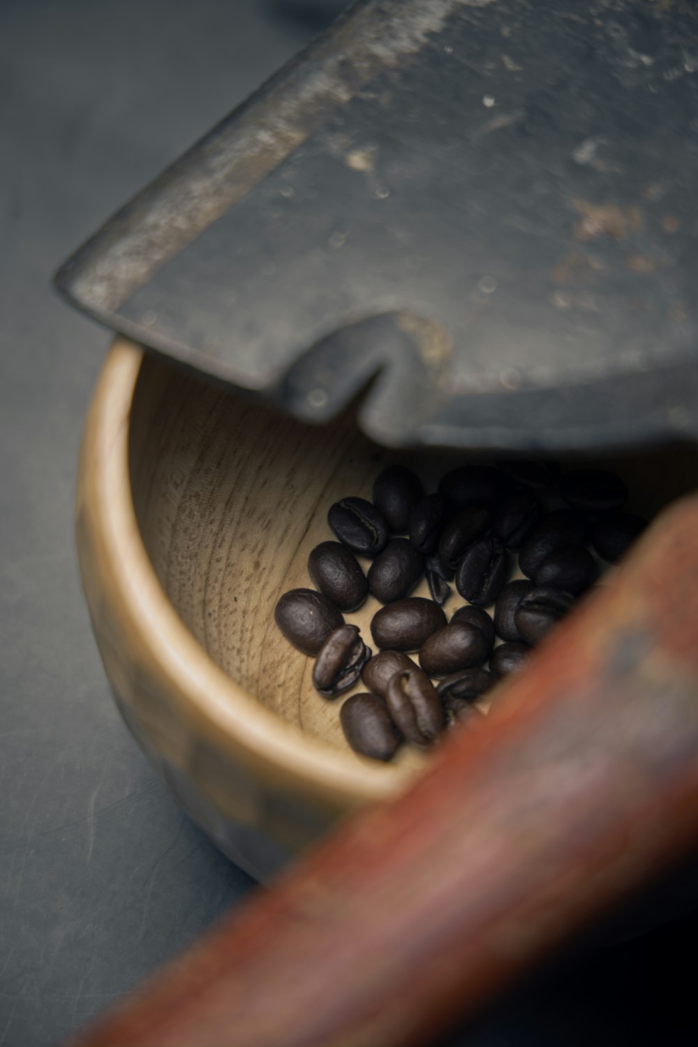 brown coffee beans in brown wooden bucket