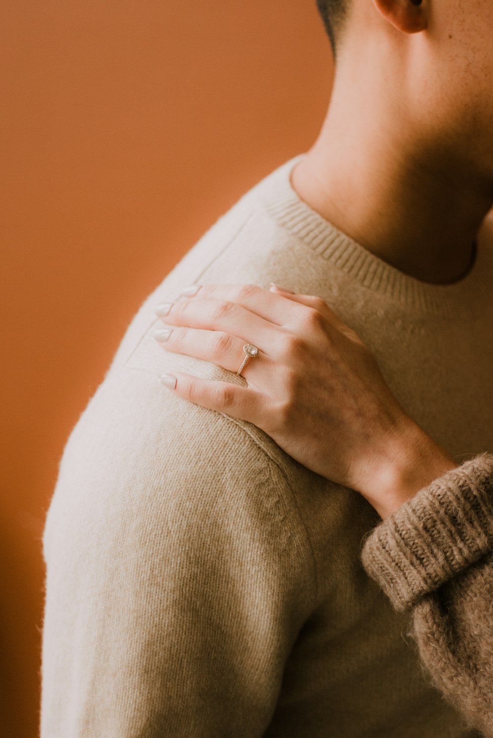 person in white knit sweater