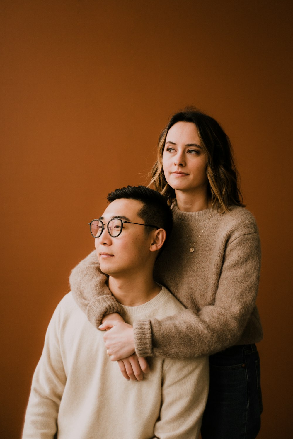 woman in white sweater wearing black framed eyeglasses