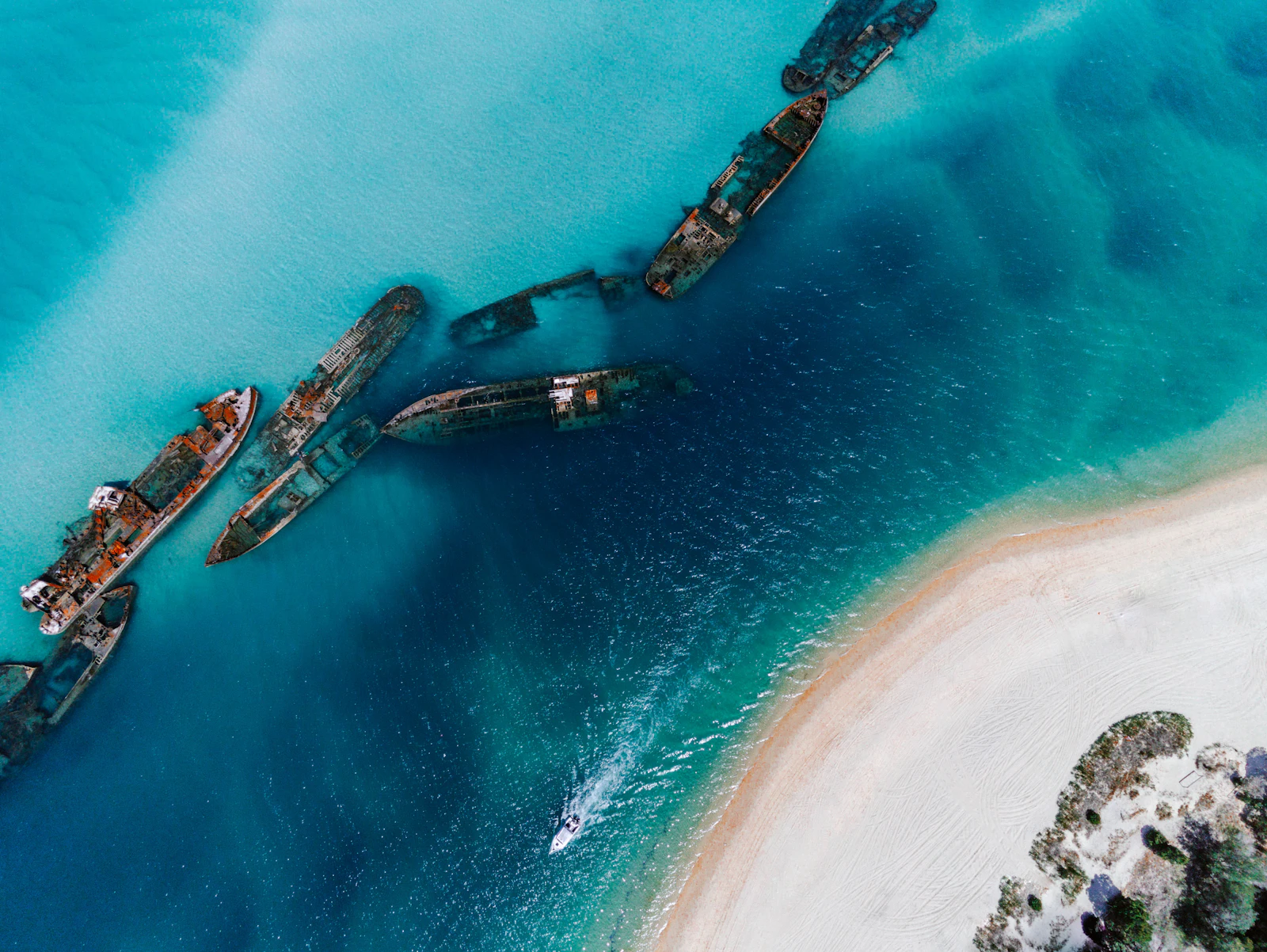 A single vessel crossing open water, seen from above