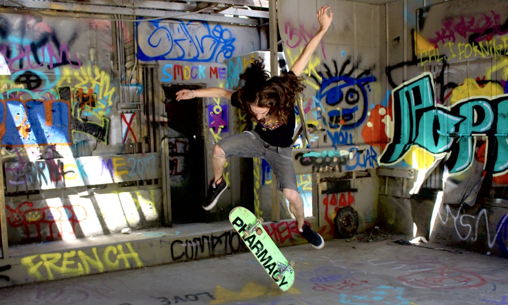 girl in gray t-shirt and black pants jumping on air