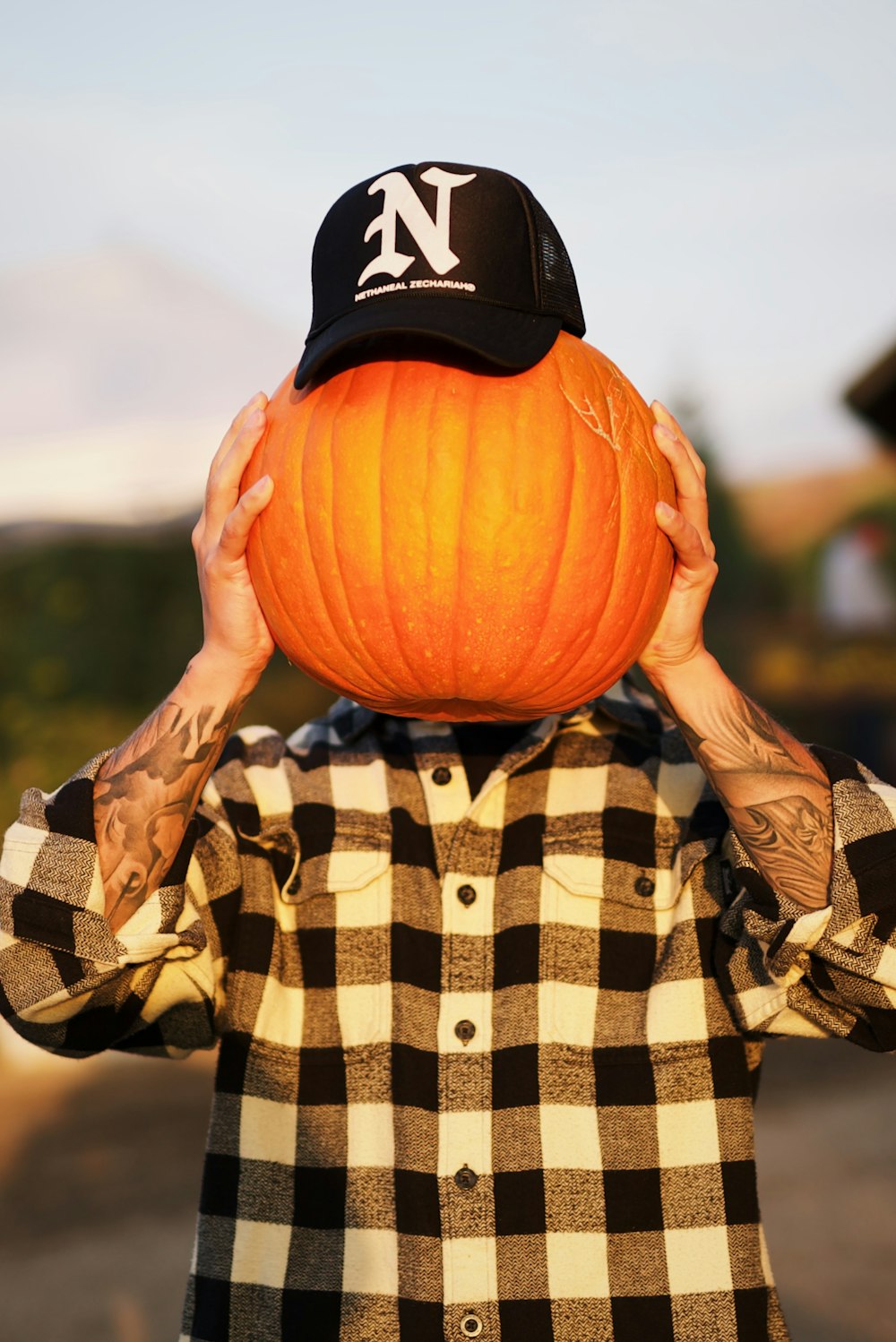 person holding jack o lantern