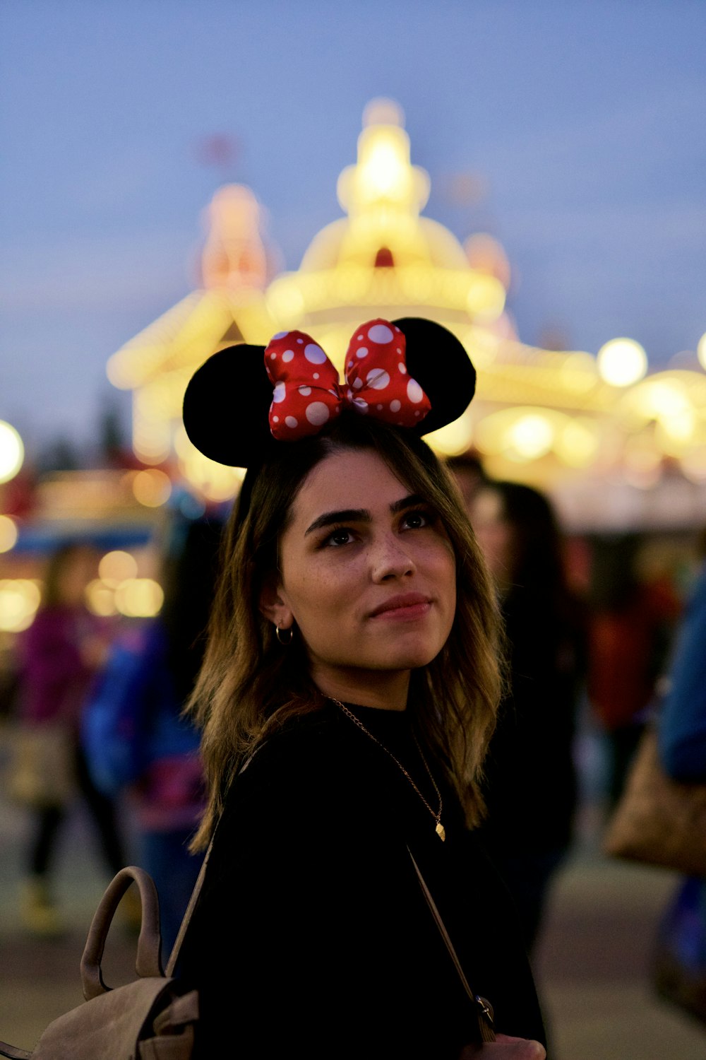 woman in black and red minnie mouse hat