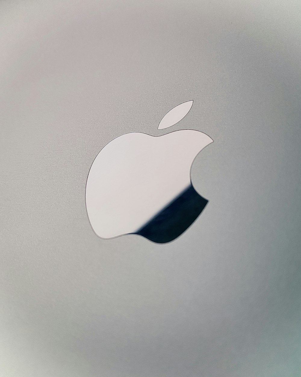 silver apple logo on silver surface