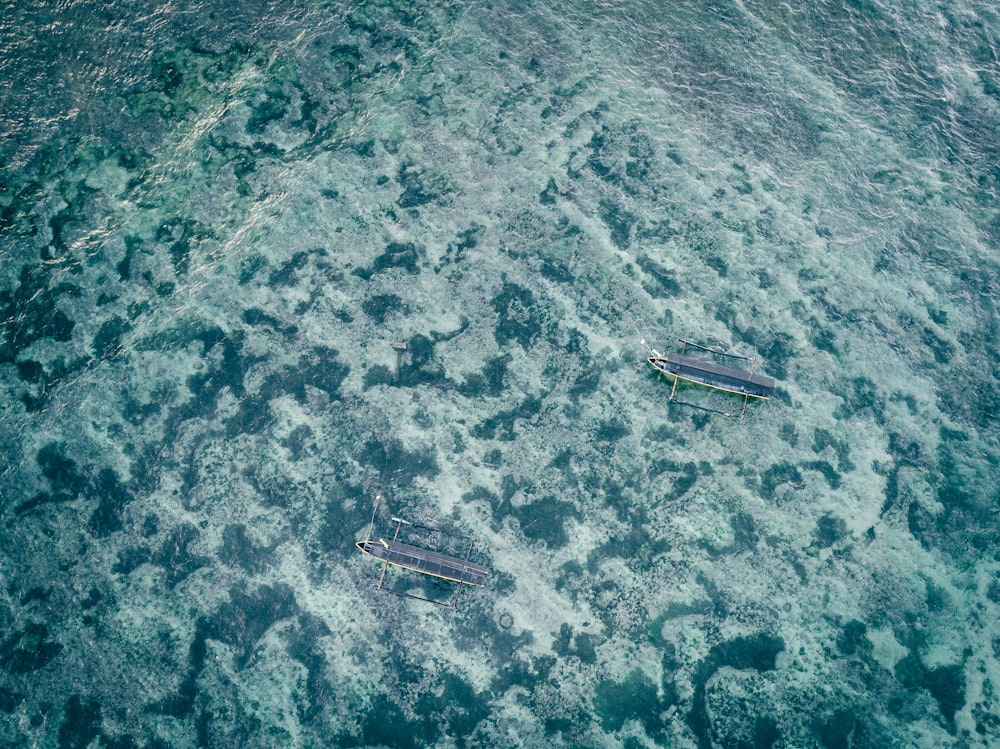 aerial view of boat on sea during daytime