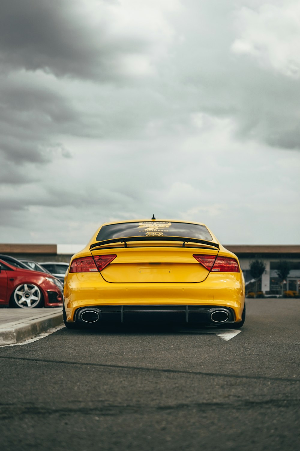 yellow chevrolet camaro on road during daytime