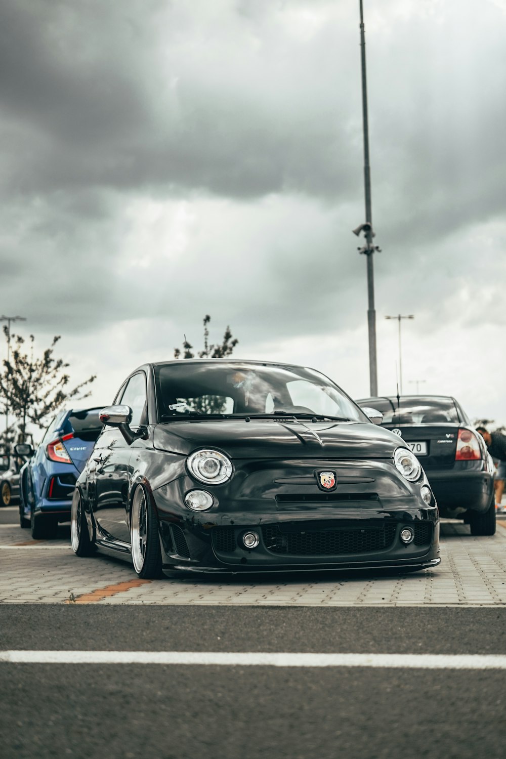 black Abarth 595 on road during daytime