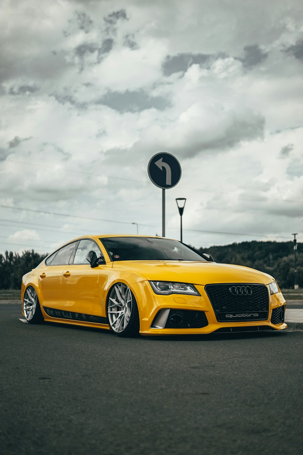 yellow mercedes benz coupe on road during daytime