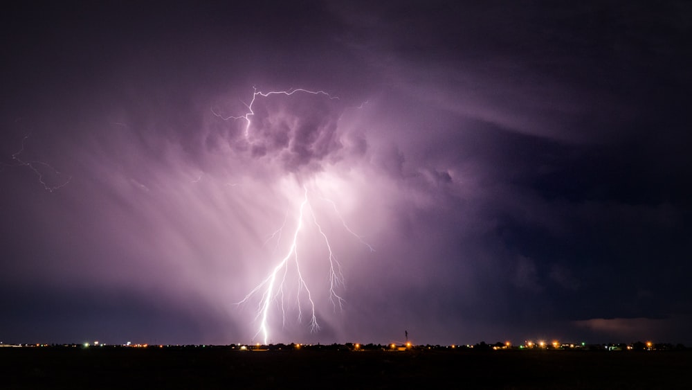 lightning strike on city during night time