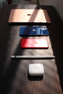 A vibrant display of sleek digital gadgets arranged on a wooden table with soft natural light.