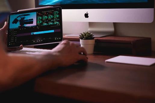 persons hand on computer screen