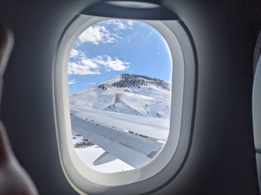 white clouds over snow covered mountains during daytime