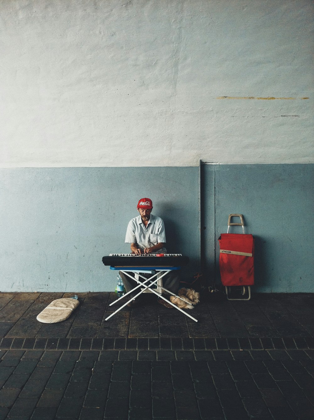 man in red jacket sitting on chair