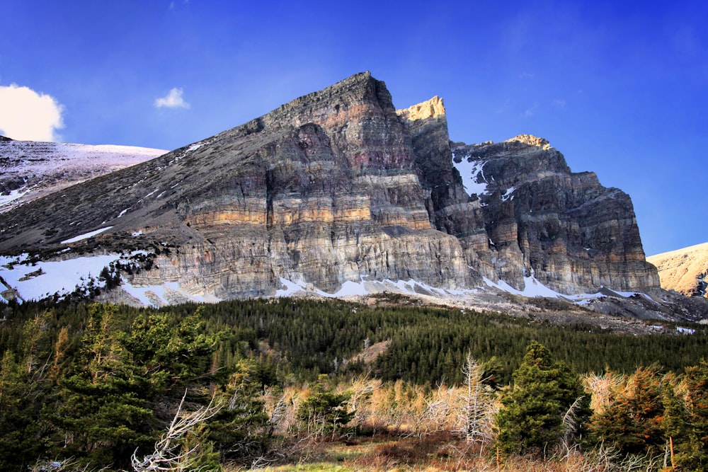 gray rocky mountain under blue sky during daytime