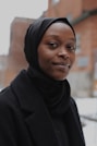 woman in black hijab and black coat