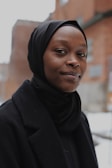 woman in black hijab and black coat