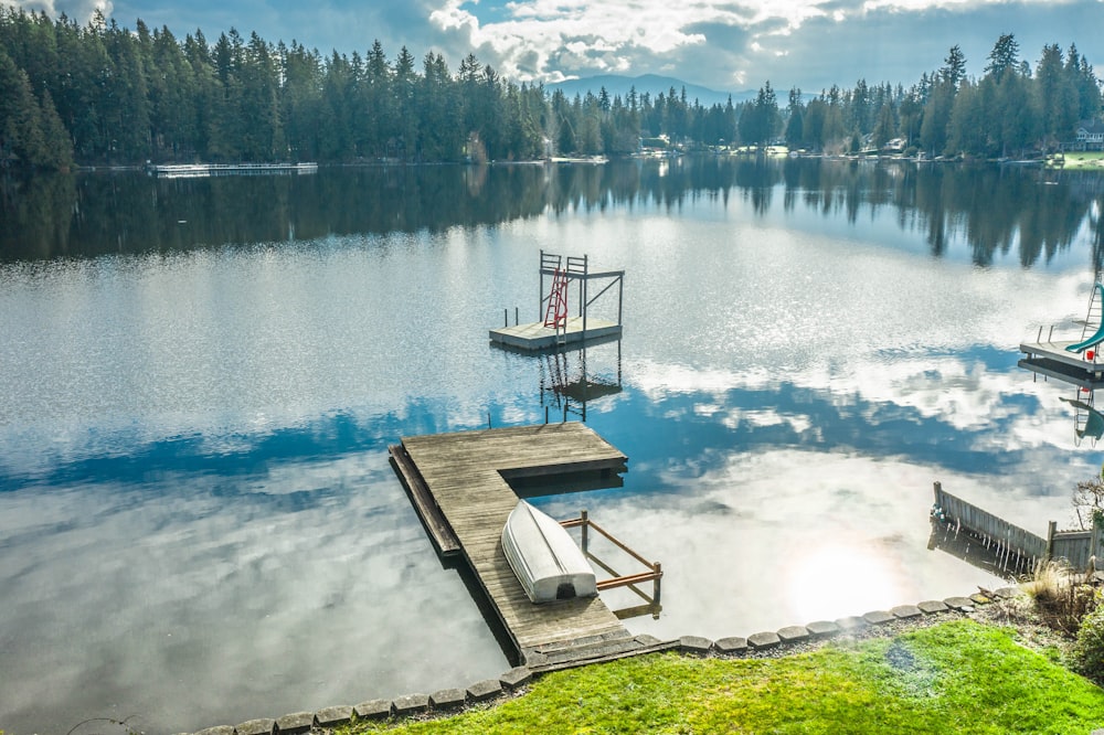 brown wooden dock on lake during daytime