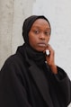 woman in black hijab and black abaya
