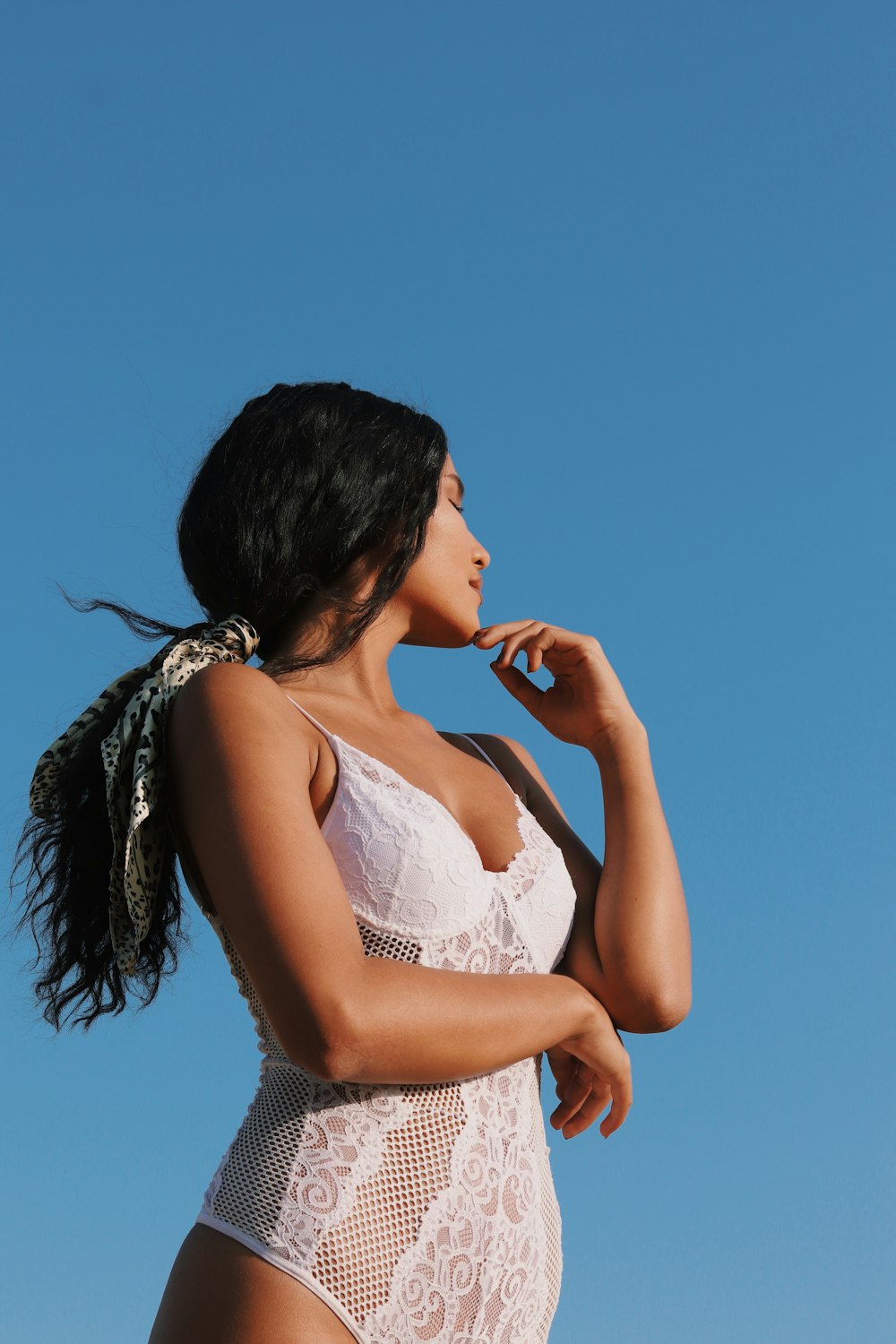 woman in white floral lace brassiere