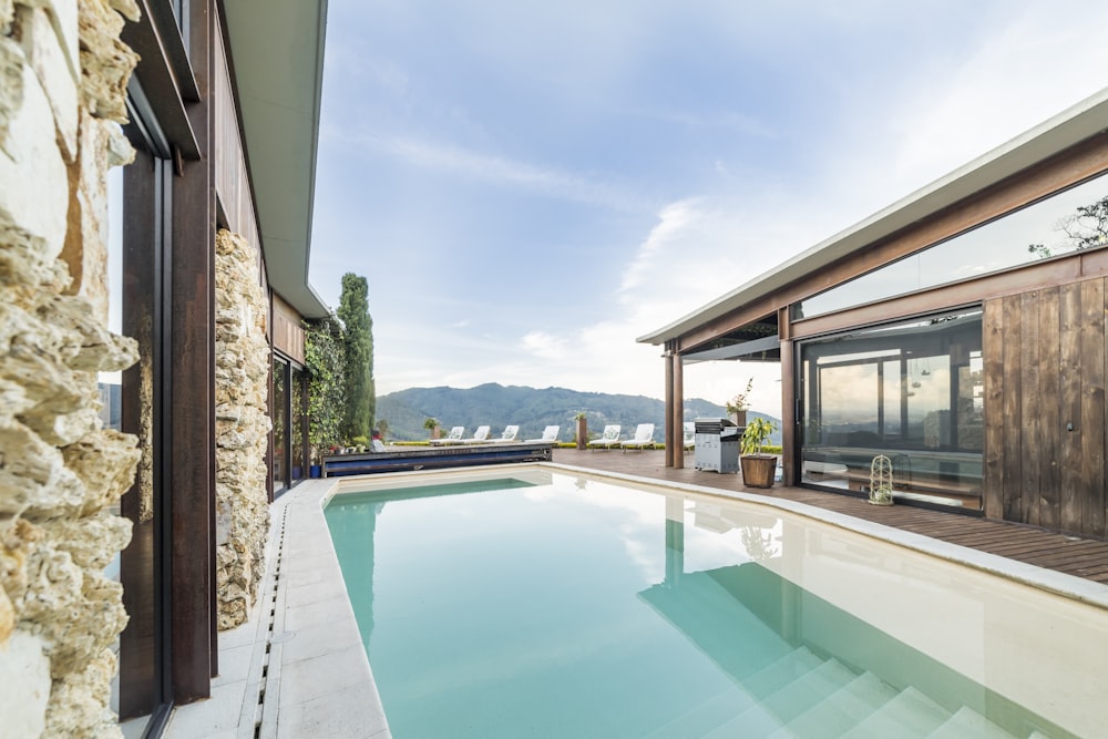 swimming pool near brown brick wall