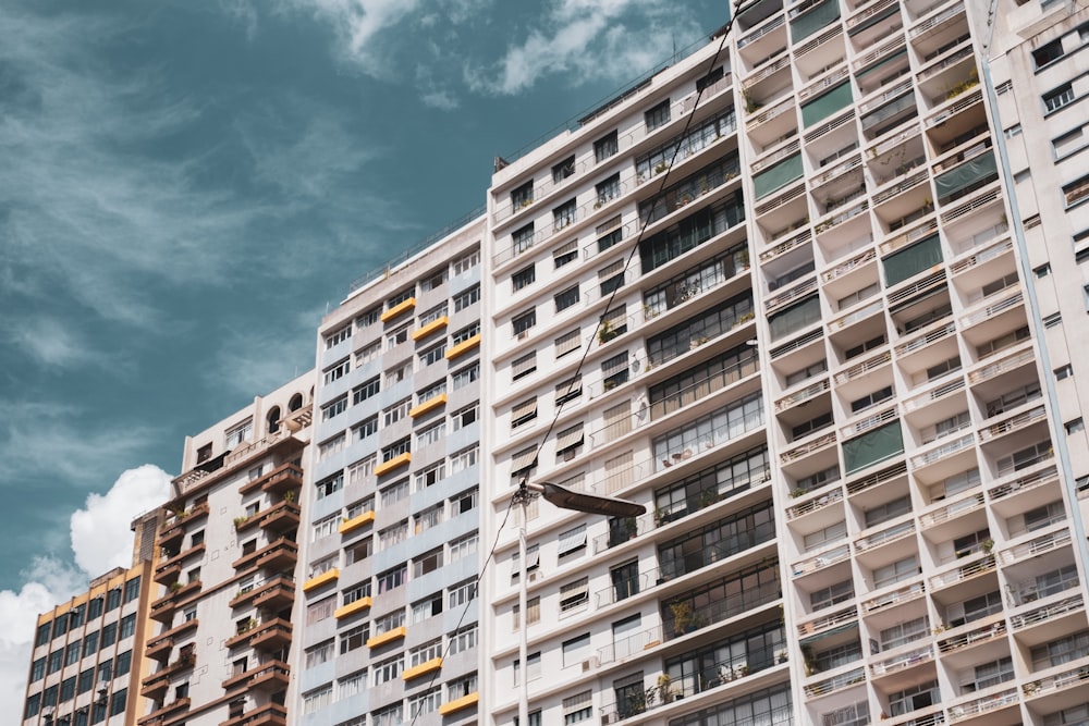 white and brown concrete building under blue sky during daytime