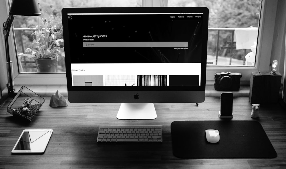 silver imac on black table