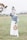 woman in white long sleeve dress holding brown hat standing on green grass field during daytime
