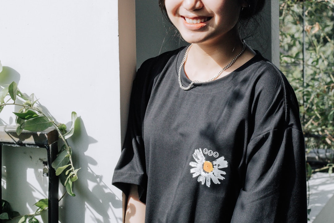 woman in black and white floral crew neck shirt