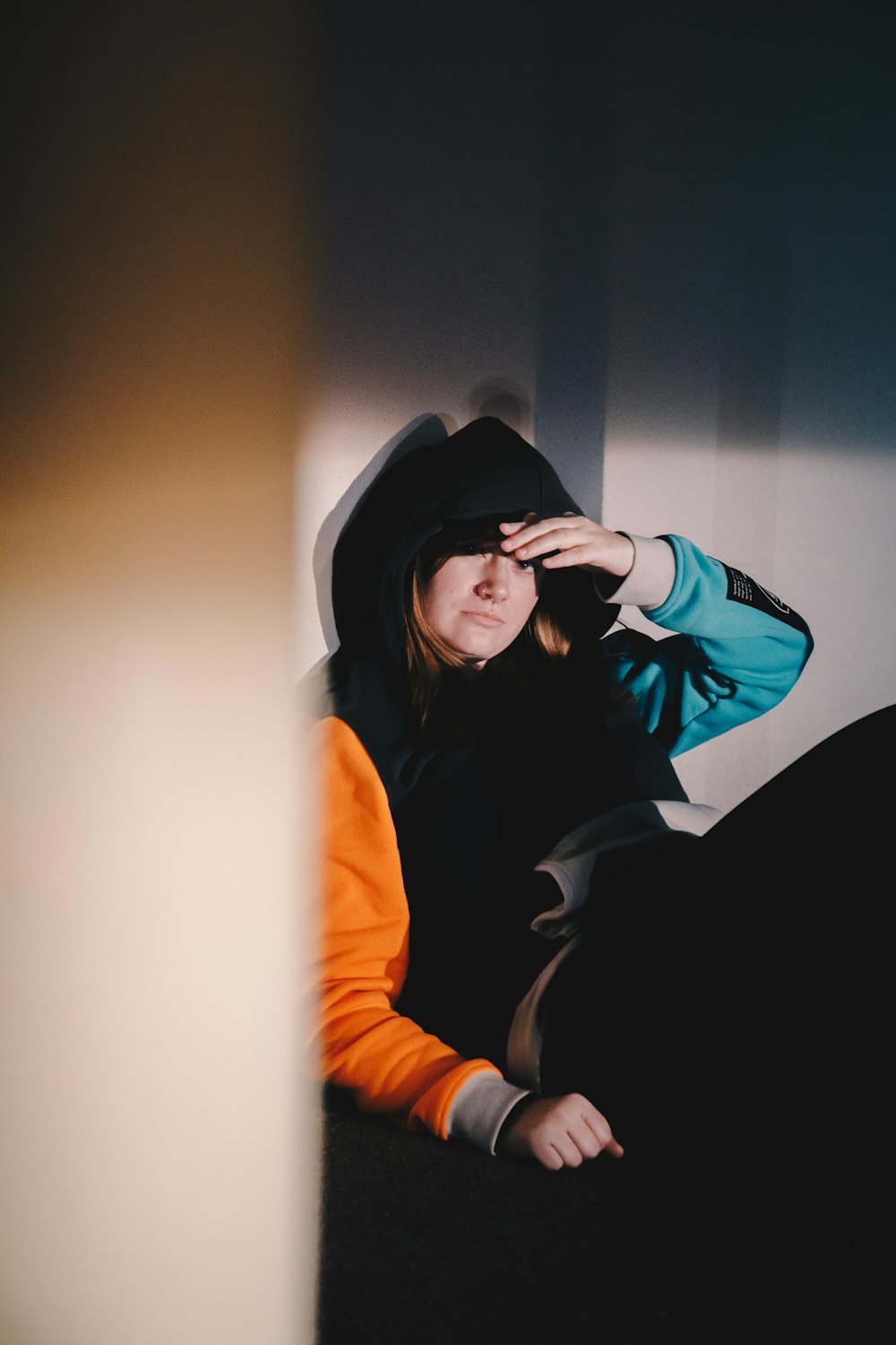 woman in black hoodie and black hat