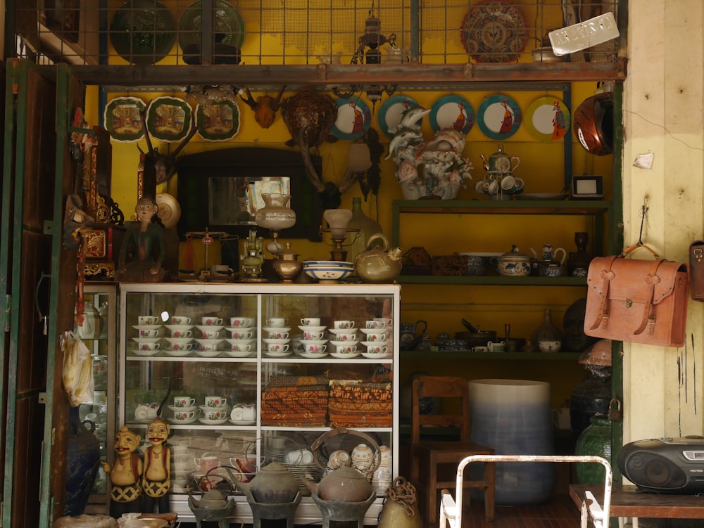 assorted ceramic mugs on shelf