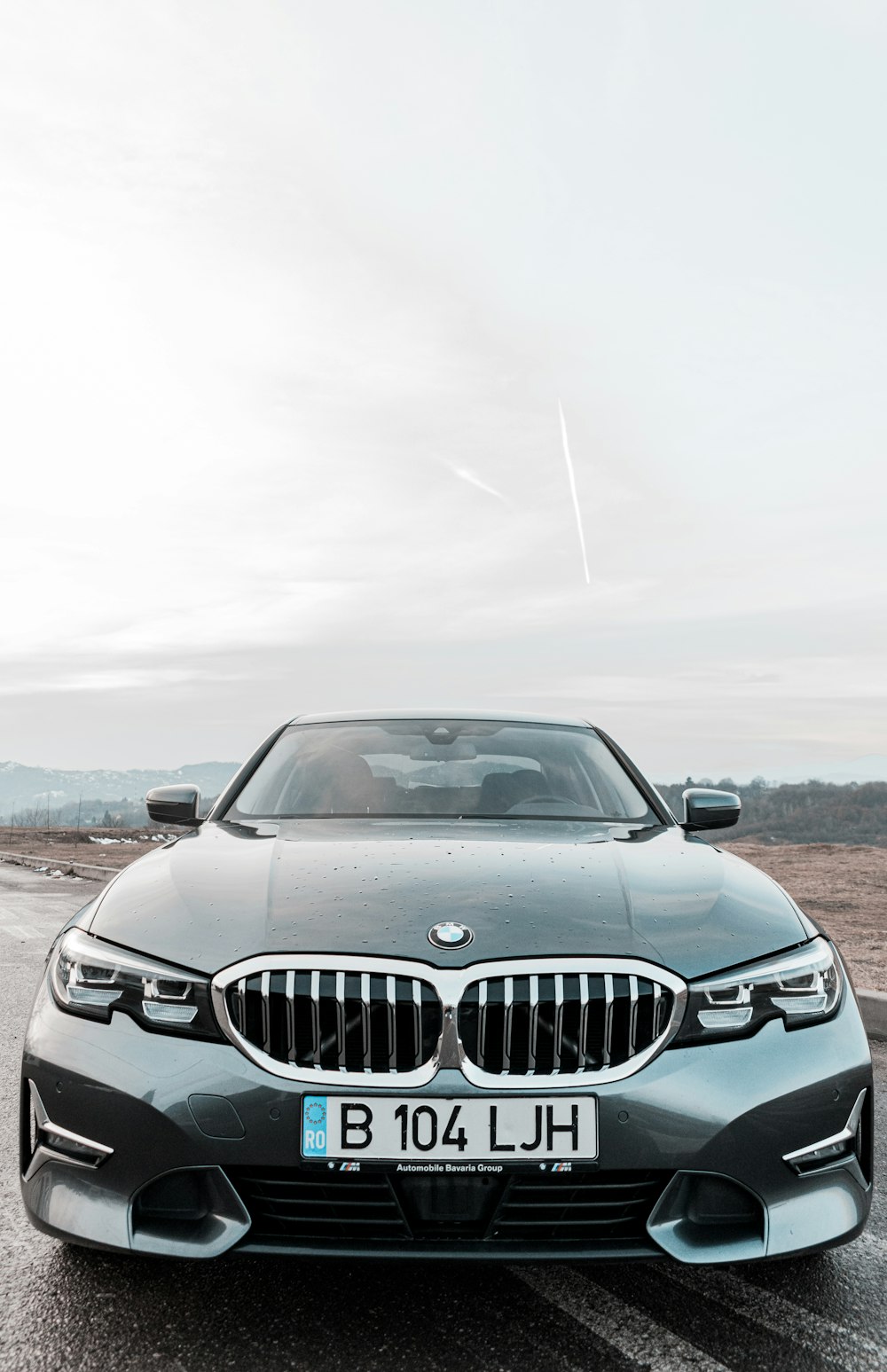 black bmw car on road during daytime