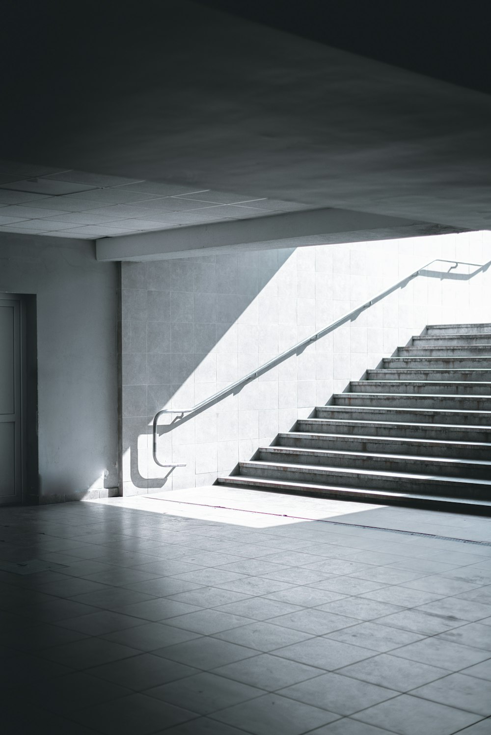 white concrete staircase with black metal railings