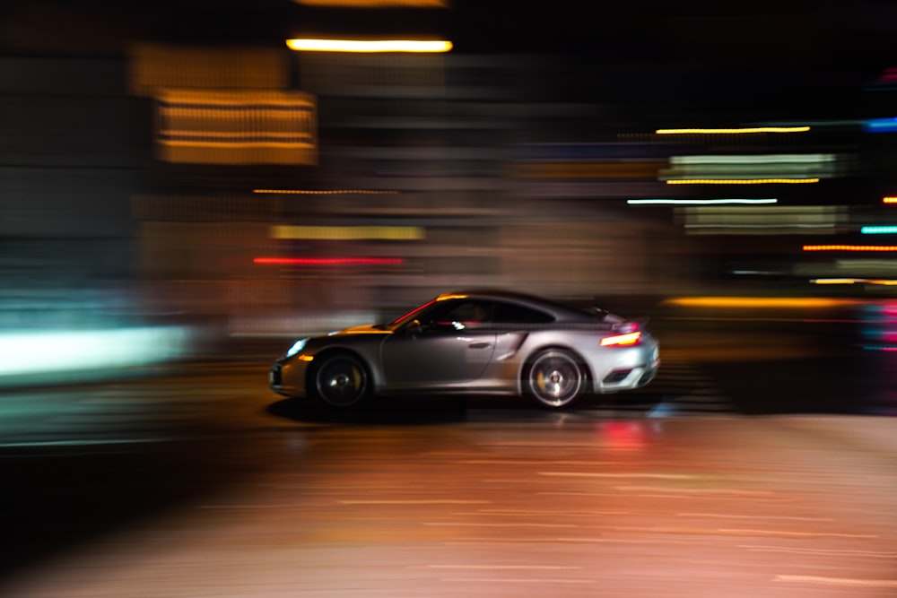 black sedan on road during night time