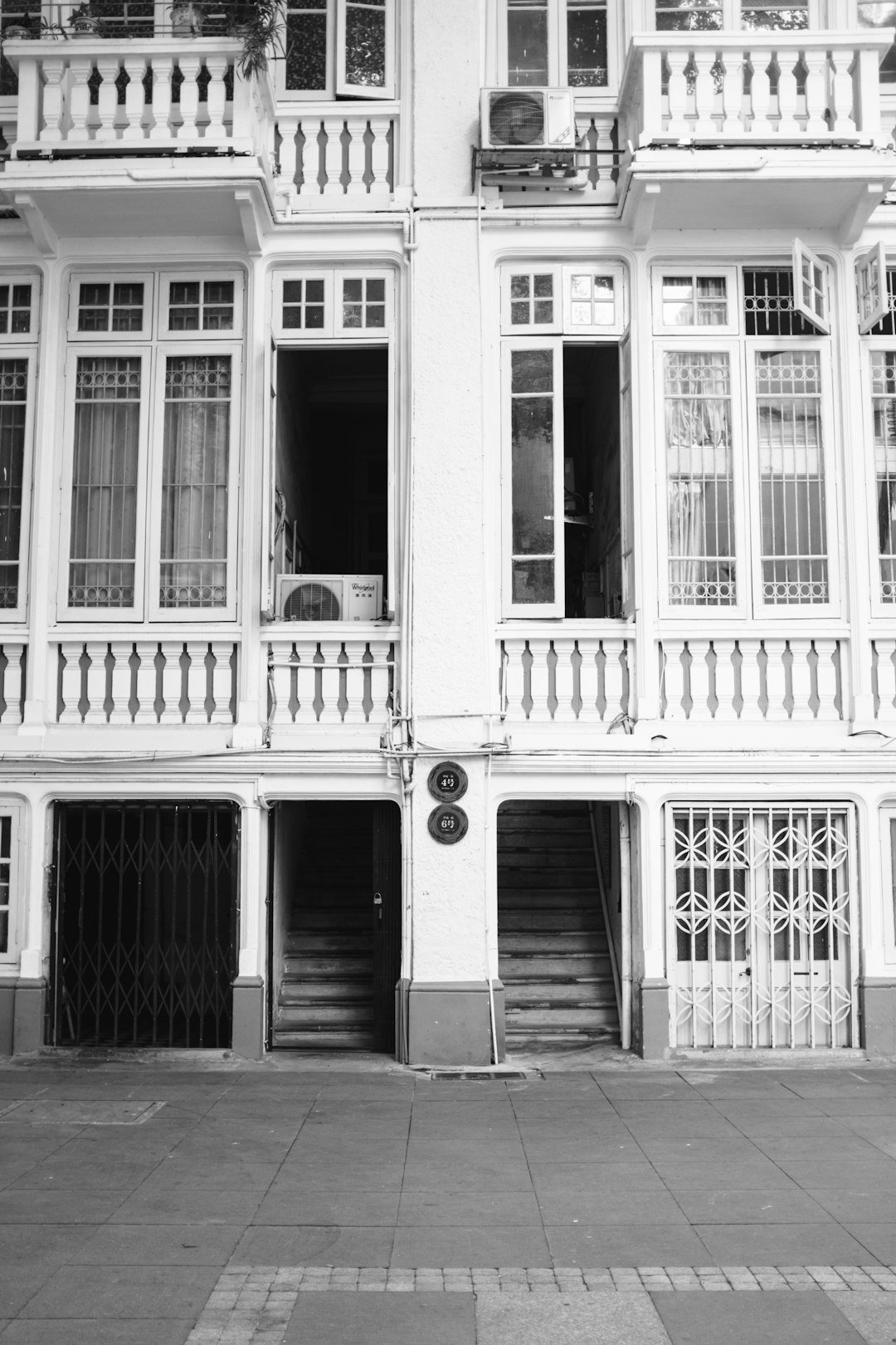 grayscale photo of 2 storey building